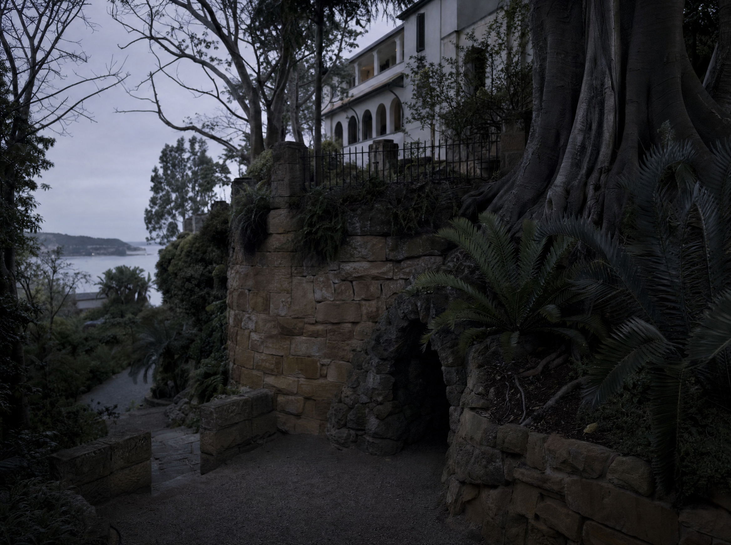 The terraced sandstone garden and grotto below the house