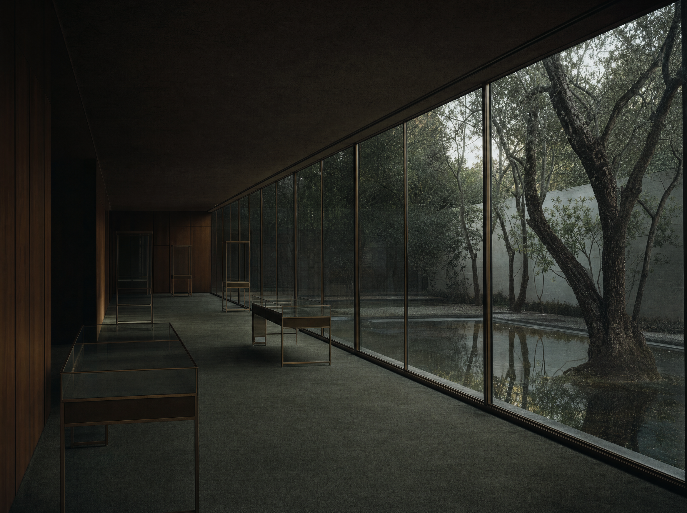 A long gallery with a fully glazed wall onto an enclosed garden of trees and still water