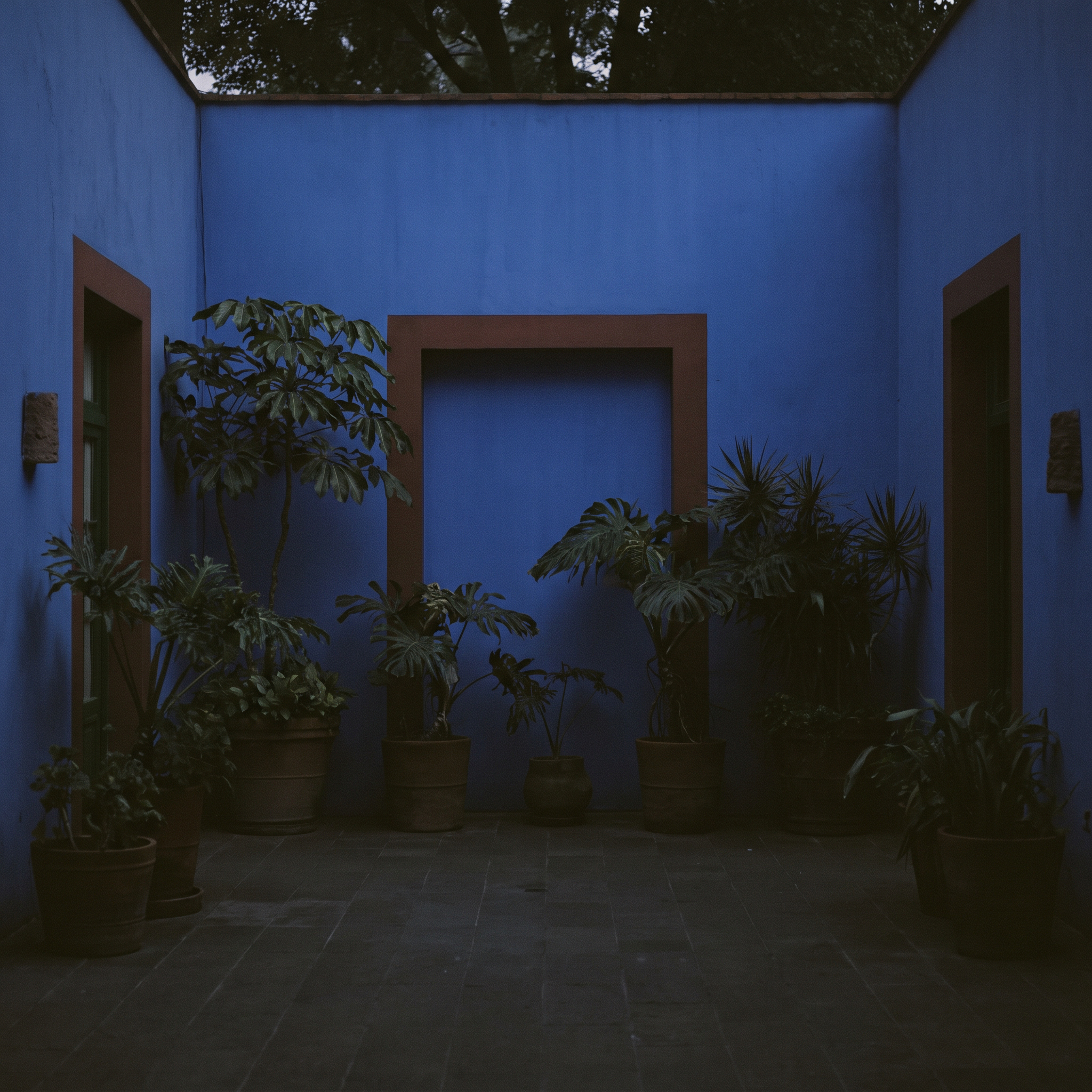 The blue courtyard walls at the end of the day