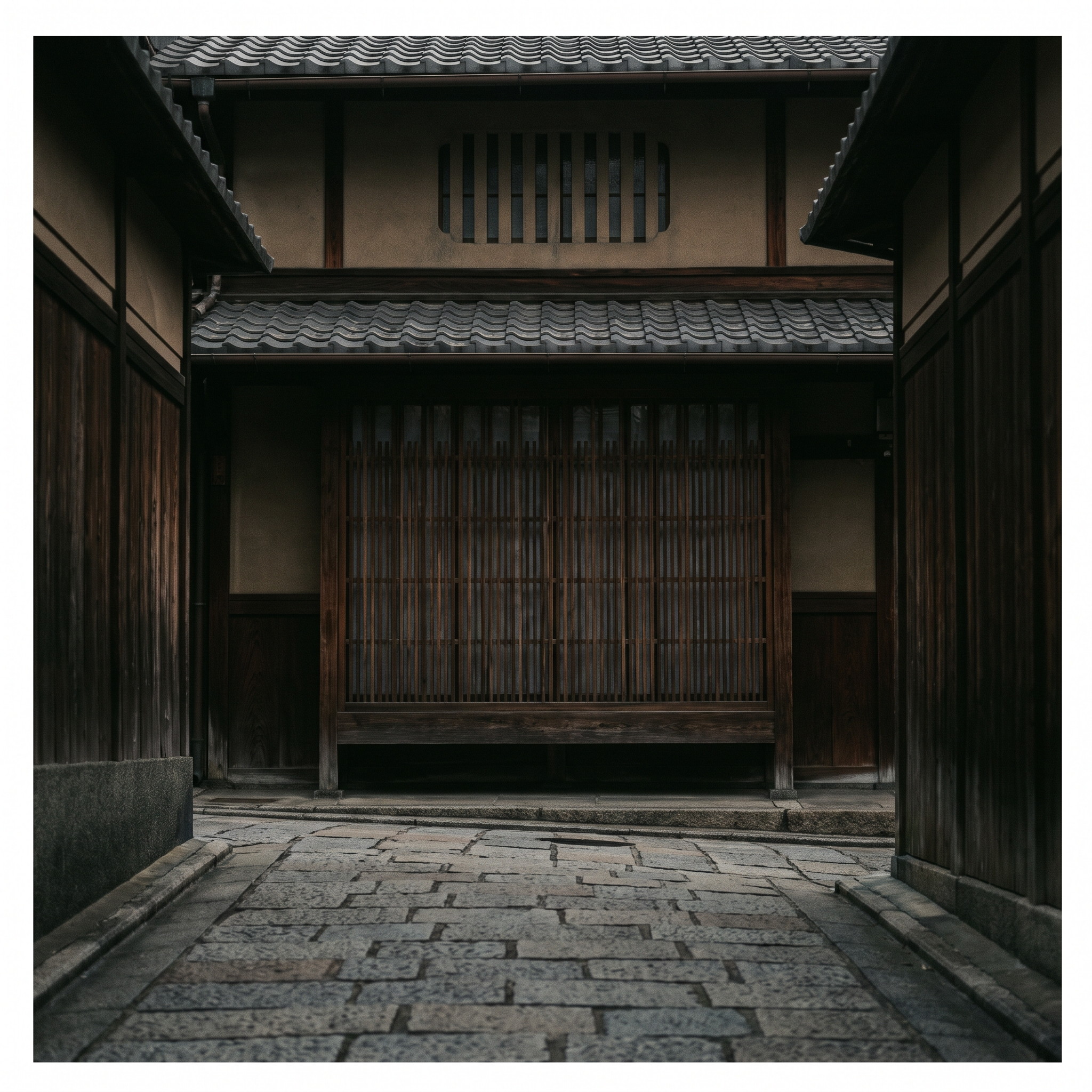 The lattice front of the house on its narrow lane