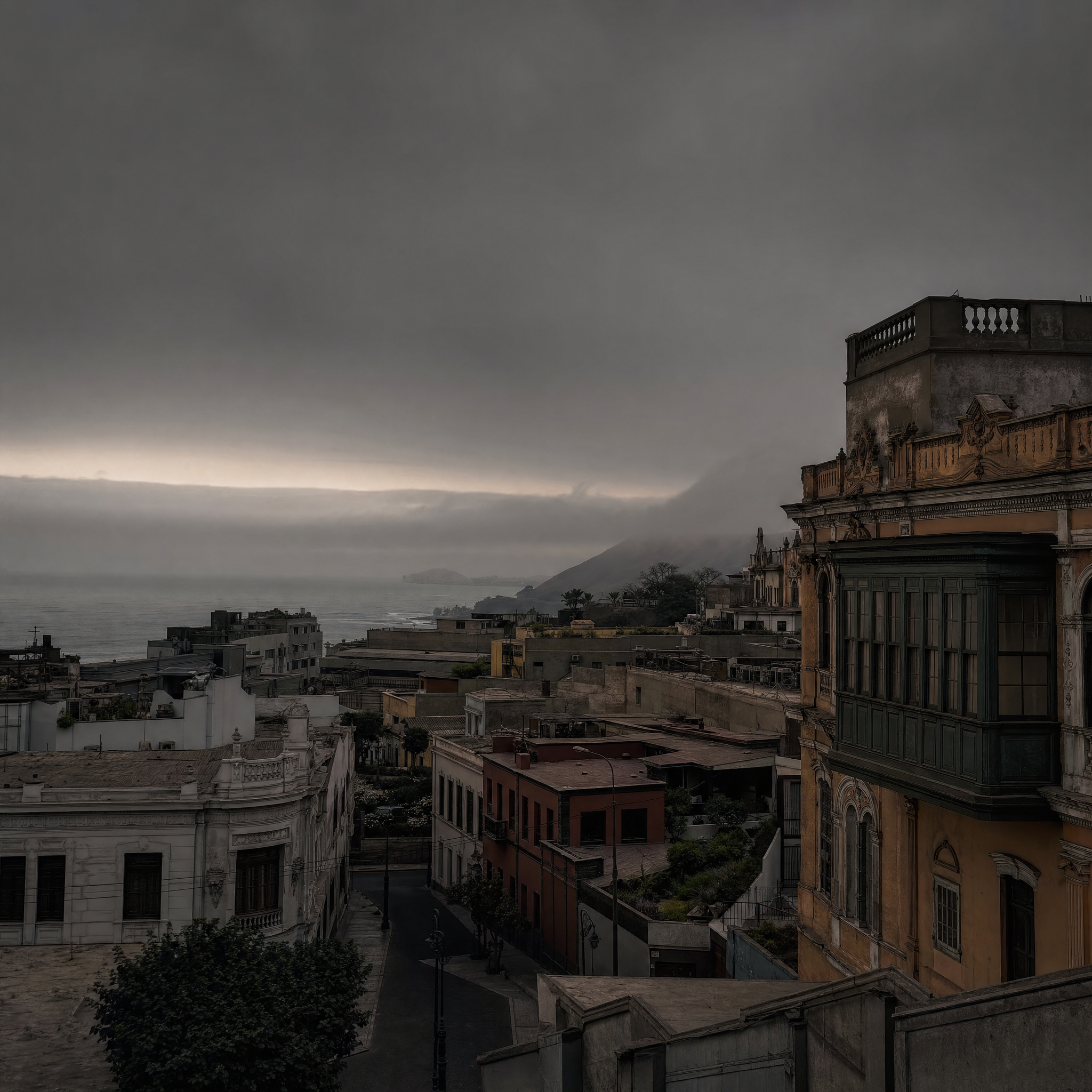 Lima rooftops and balconies under flat grey coastal light, sea fog beyond