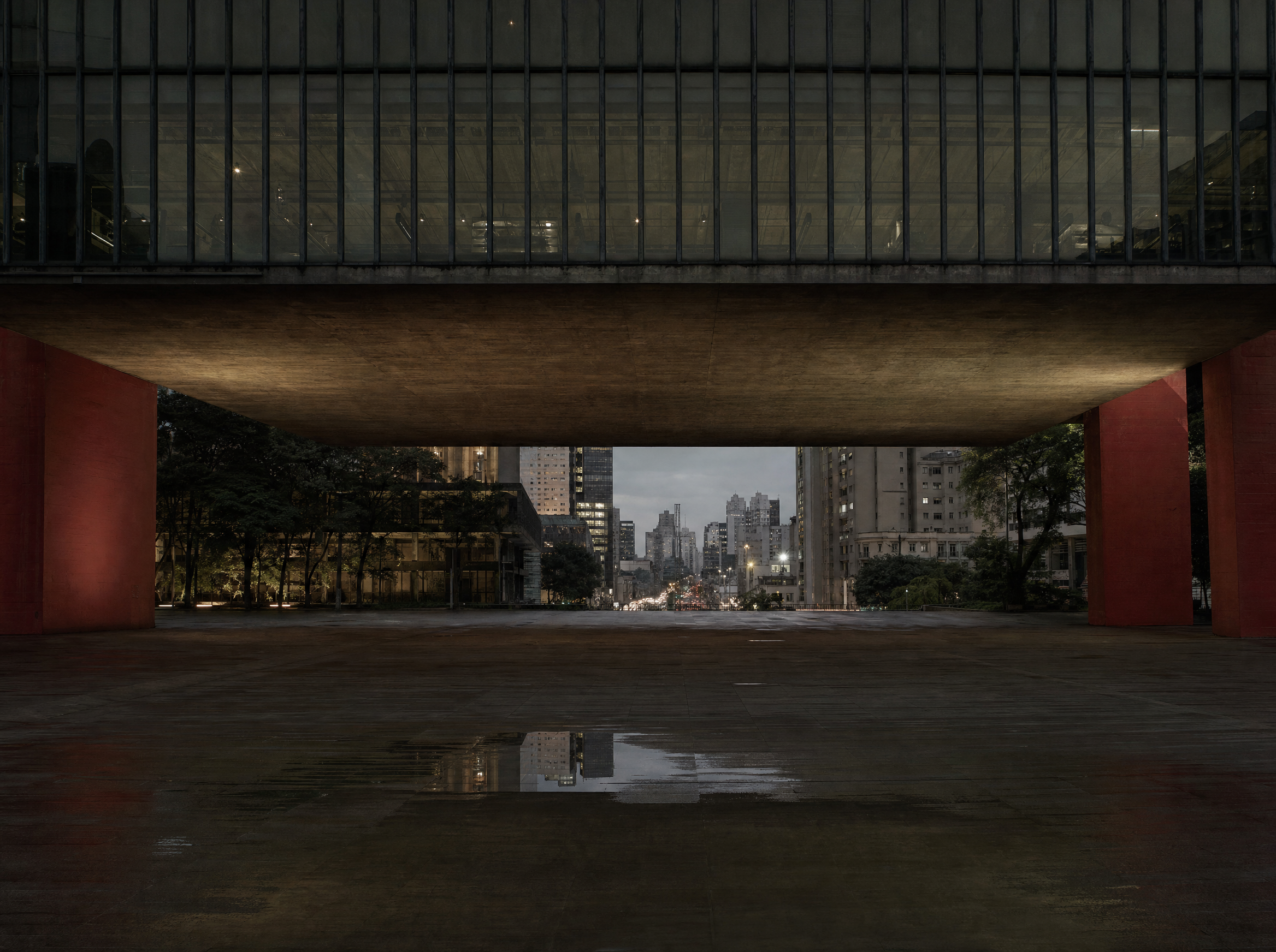The open public plaza beneath the museum, seventy-four metres clear between the supports