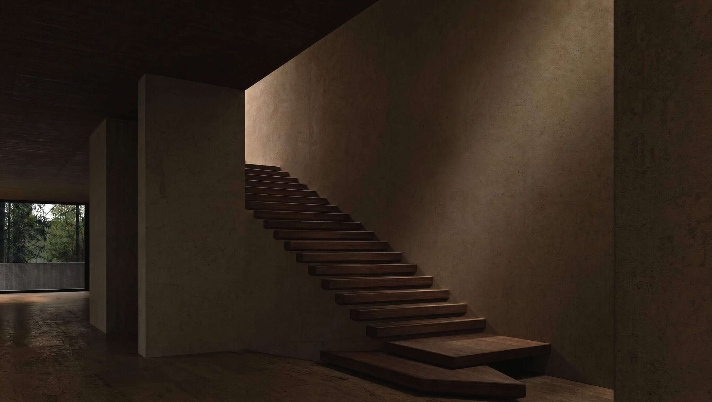 An empty modernist interior: thick plaster walls, a plain wooden stair, one shaft of low light
