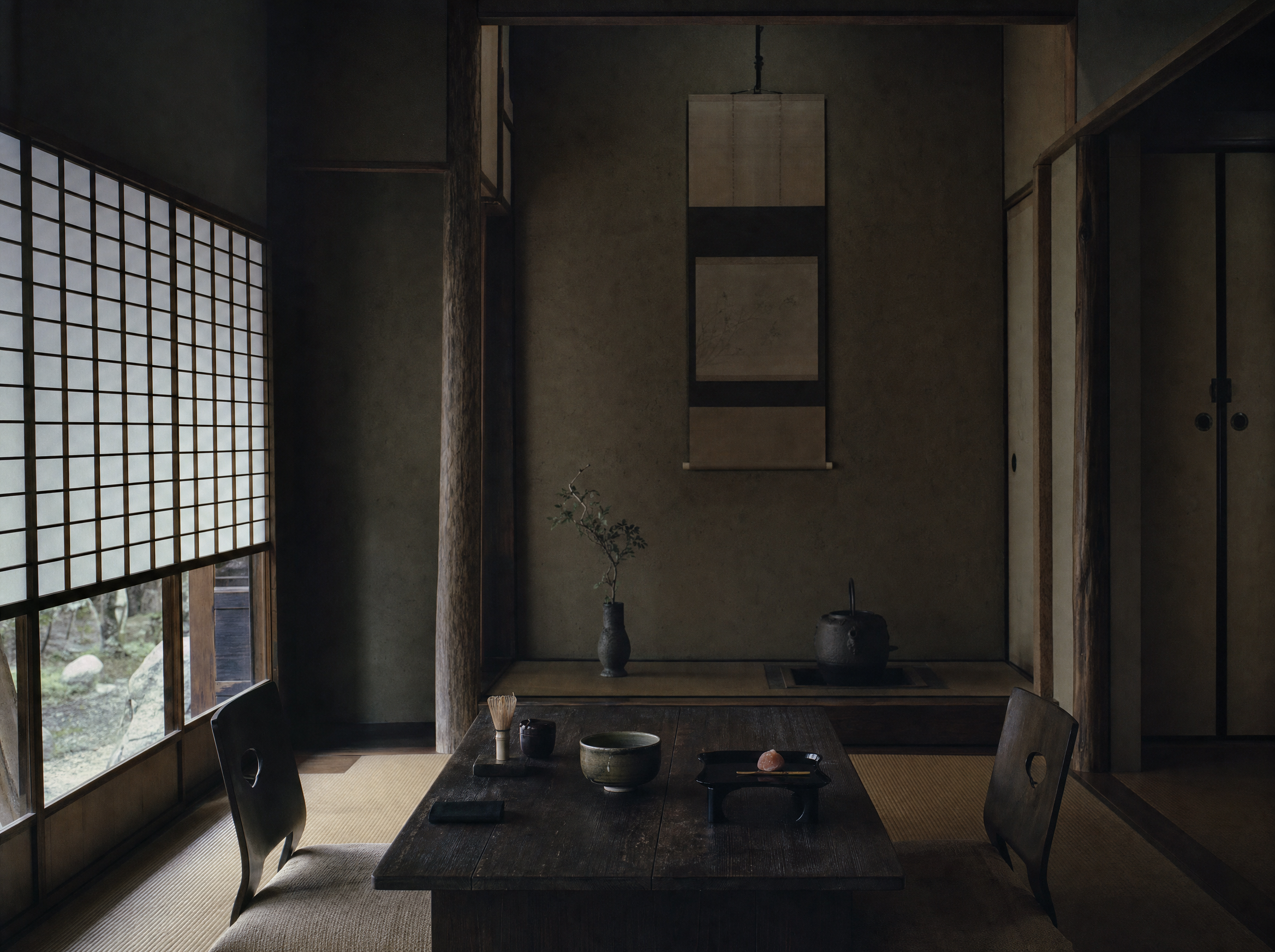 The ryūrei tea seating, table and chairs set with a bowl and a kettle