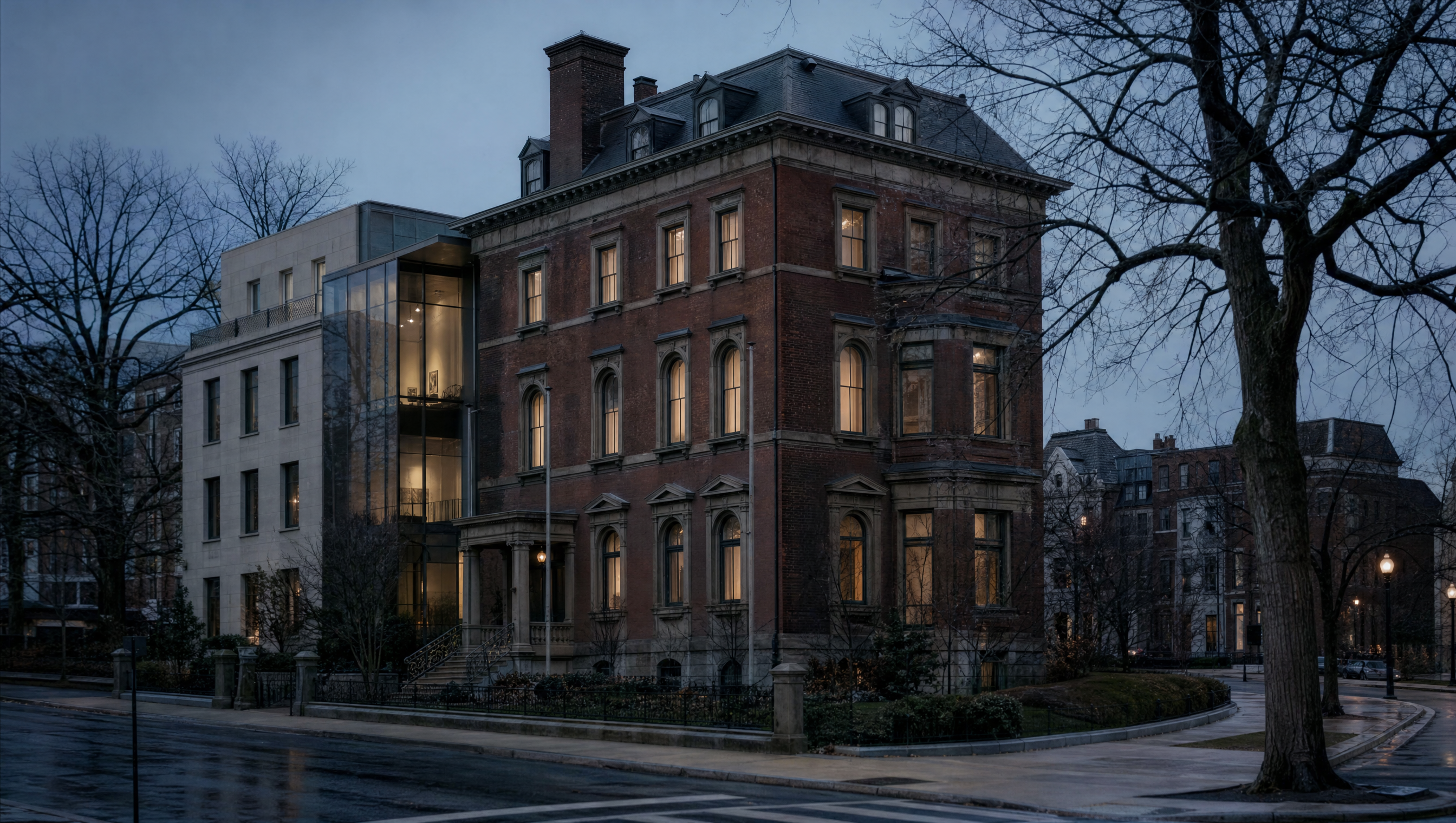 The brick and brownstone Phillips house near Dupont Circle at blue hour, its modern gallery wing alongside