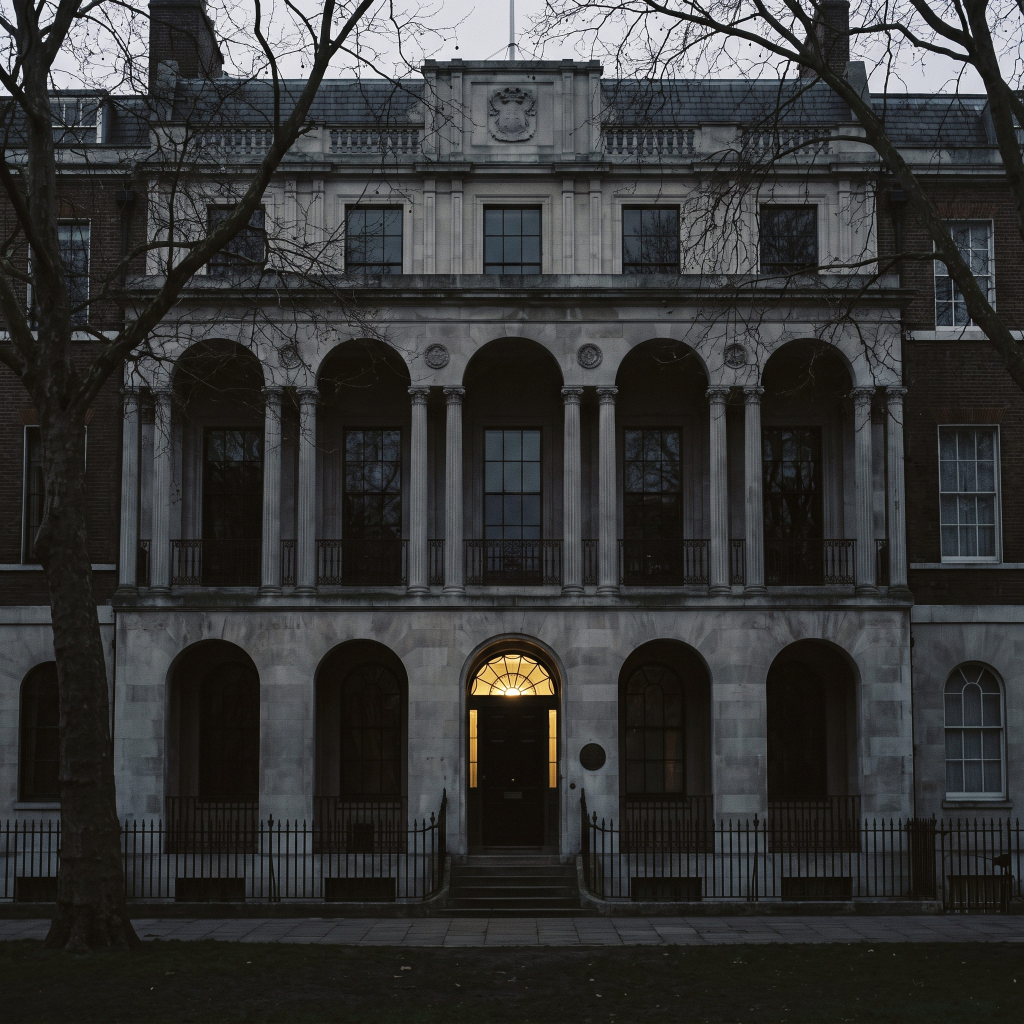The stone loggia front of Sir John Soane's Museum on Lincoln's Inn Fields at dusk